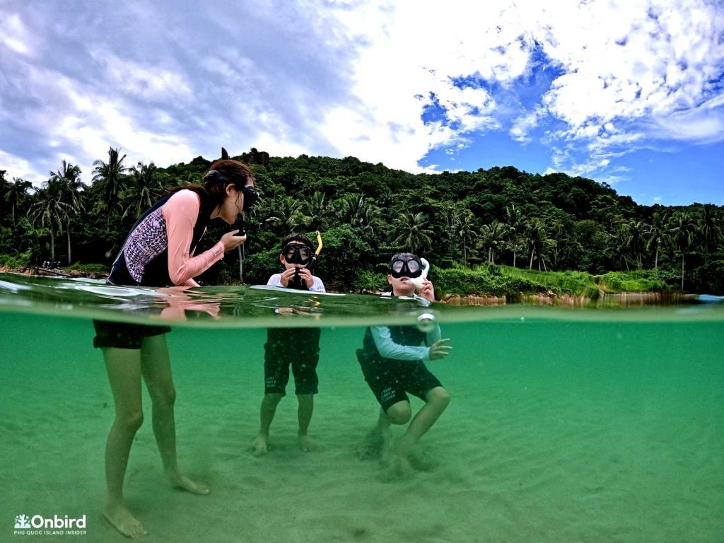 Kid snorkeling in Phu Quoc Island, Vietnam. North-east Coral reef