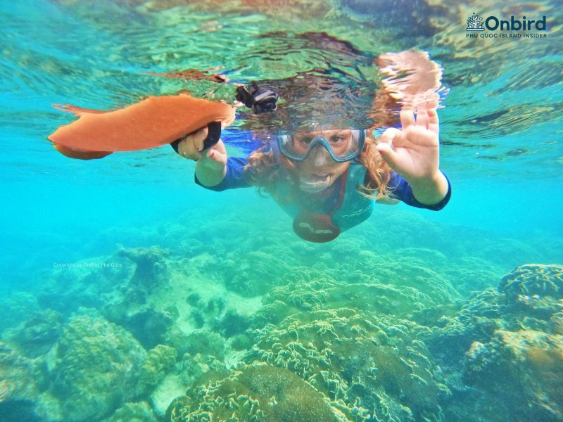 A 6-year-old girl snorkeling at Phu Quoc Coral Mountain, Phu Quoc Island, Vietnam