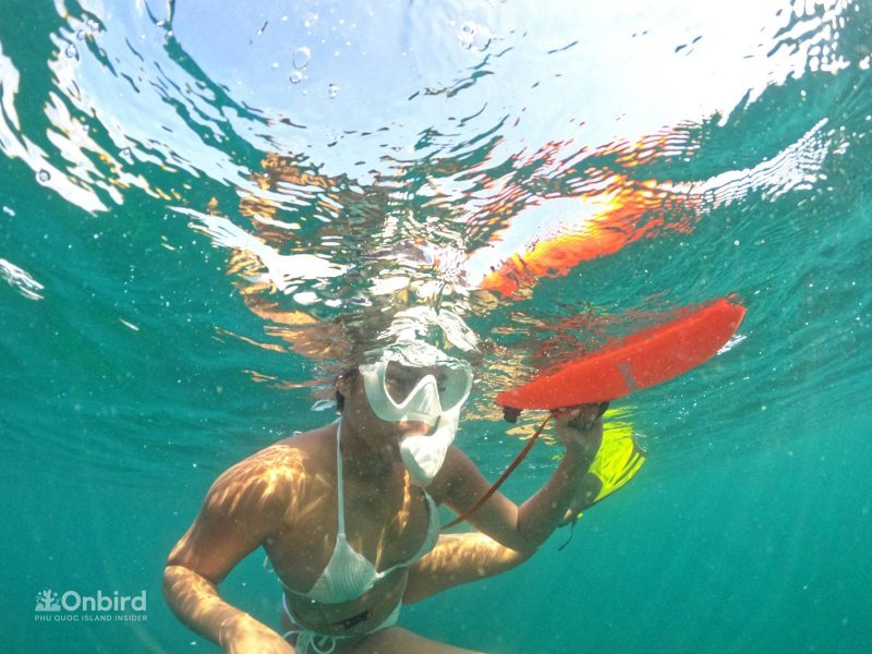 Brittney in the water with our full snorkeling gears