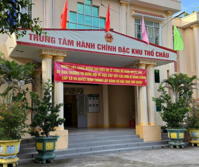 The Tho Chau Special Zone Administrative Center with the Vietnamese flag and colorful banners flying, signifying the island's new administrative body.