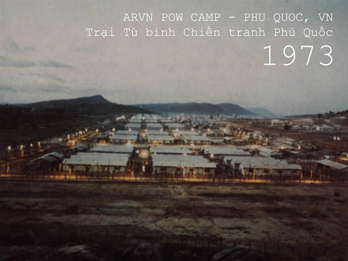 Panoramic view of Phu Quoc Prisoner of War Camp (ARVN POW Camp) in 1973, with rows of tin-roof barracks spread across a wide valley.