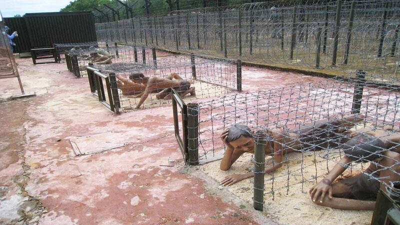 Model of the “tiger cages” at Phu Quoc Prison, where prisoners were once confined in cramped spaces beneath layers of barbed wire.